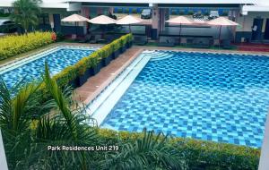 Bazén v ubytování PARK RESIDENCE Unit 219, SM City Santa Rosa, Laguna, by SMDC nebo v jeho okolí + 3 fotografie