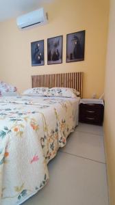 En eller flere senge i et værelse på Residência Lima 1