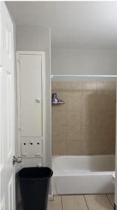 a bathroom with a toilet and a bath tub at Mike's home 1 in Texas City