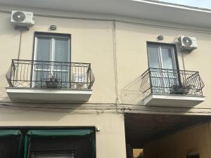 two balconies on the side of a building at Micky House in San Marzano sul Sarno