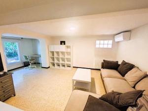 a living room with a couch and a table at T2 proche centre et plages du Pradet in Le Pradet