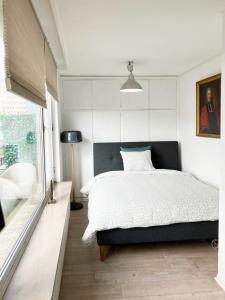 Ένα ή περισσότερα κρεβάτια σε δωμάτιο στο Unique Penthouse Knight Philippe II von Habsburg
