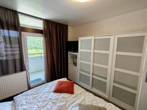 a bedroom with a bed and a window at Ferienwohnung Harz Valley in Niederdorla +11 photos