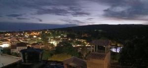 a view of a city at night at Casa azul in Lençóis +3 photos