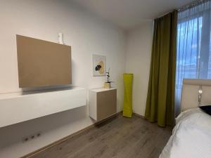 En eller flere senge i et værelse på Bob Residence- Chic Penthouse