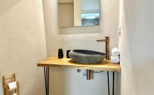 a bathroom with a bowl sink on a counter at Knight House Akko in ‘Akko
