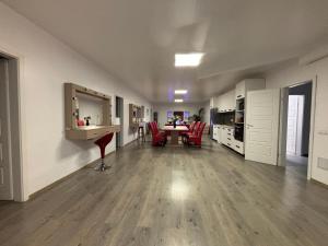 an empty living room with a table and chairs at Bob Residence- Chic Penthouse in Cluj-Napoca