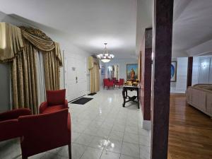 a living room with a couch and a table at White House Canada in Brampton