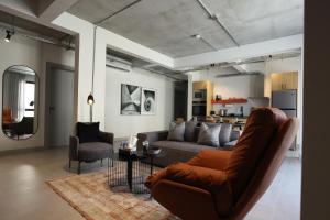 a living room with a couch and a table at C Living 3 - Al Malqa in Riyadh