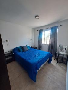 Ένα ή περισσότερα κρεβάτια σε δωμάτιο στο Departamento Costa Azul