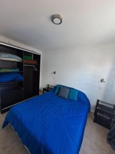 Ένα ή περισσότερα κρεβάτια σε δωμάτιο στο Departamento Costa Azul