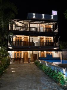 a building at night with the lights on at Villa Rosella in Ahangama