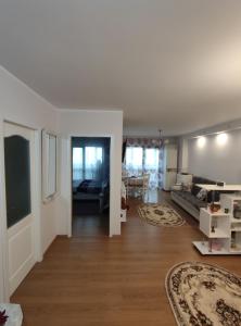a living room with a couch and a table at Lumar Residence Sibiu in Şelimbăr +11 photos