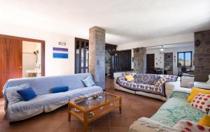 a living room with a couch and a table at Villa mare panoramica Estia in Brancaleone Marina