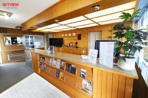 a library with a counter with books on it at SkyView Swift Current in Swift Current