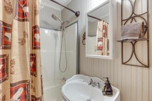 a bathroom with a sink and a shower at Mossy Creek Cabin in Cleveland +33 photos
