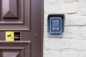 a cell phone on the side of a door at Modern studio in Siena Tirgus in Rīga +32 photos