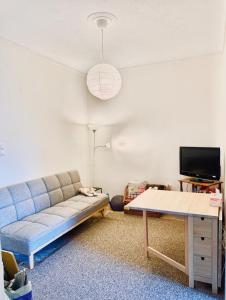 a living room with a couch and a table at Pinetree House in Nafplio