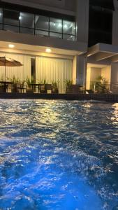 a swimming pool with blue water in a hotel at Ocean View Hotel in Accra
