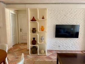 TV/trung tâm giải trí tại Casa Colibrí con piscina privada