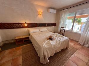 Giường trong phòng chung tại Casa Colibrí con piscina privada +65 ảnh