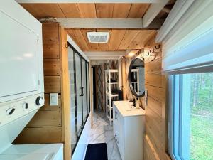 a bathroom with a sink and a mirror at Exode en Nature in Sainte-Rose-du-Nord +202 photos