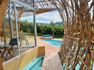a house with a view of a swimming pool at IslaVerde Hotel in La Mesa