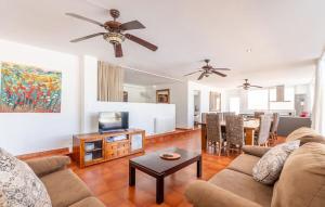 a living room with a couch and a dining room at Finca Ca Nostra, Charmante Villa, Großzügiger Pool & Meerblick in Llucmajor