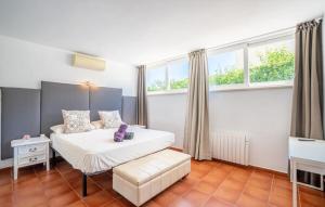 a bedroom with a white bed and a window at Finca Ca Nostra, Charmante Villa, Großzügiger Pool & Meerblick in Llucmajor +46 photos