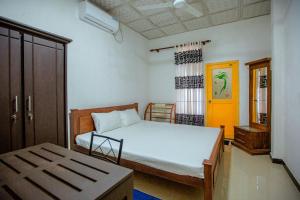 Ένα ή περισσότερα κρεβάτια σε δωμάτιο στο Yala Sunset Villa