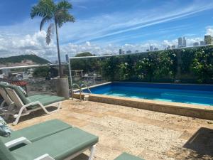a swimming pool on the roof of a building at Casa Ebano 967 in Cartagena de Indias