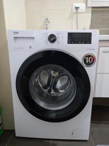 a white washing machine in a kitchen at Azar in Bar