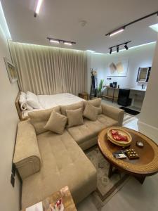 a living room with a couch and a table at سندباد in Riyadh