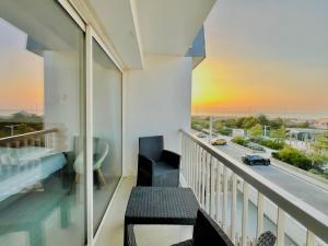 a balcony with a view of a highway at Hôtel Le Littoral - Berck sur Mer in Berck-sur-Mer