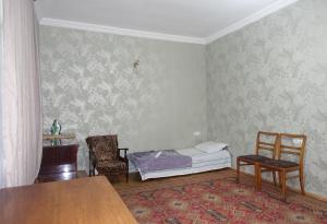 Postel nebo postele na pokoji v ubytování Bigapart sity centre, old Tbilisi + 5 fotografií
