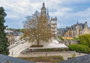 a view of a city with a clock tower at L'Evraude - Centre-Ville - Gare in Évreux