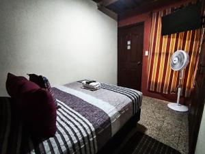 Ένα ή περισσότερα κρεβάτια σε δωμάτιο στο Posada Jireh