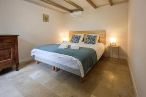Ένα ή περισσότερα κρεβάτια σε δωμάτιο στο Le Clos André - Climatisation - Jardin - Chambord