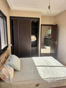 a bedroom with a large bed in a room at Appart For Rent Kech in Marrakech