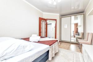 Postel nebo postele na pokoji v ubytování Комфортная однокомнатная квартира возле Астана Вижн и КазГЮУ