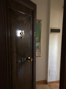 a wooden door with a snowflake design on it at Rose in Tirana