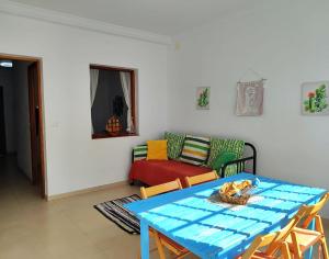 a living room with a table and a couch at Riegos de Lino in Barlovento