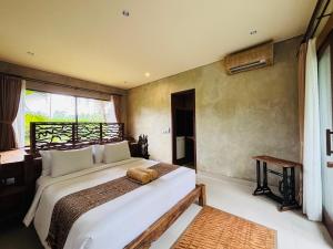 a bedroom with a large bed and a window at ELForest ex Karang Dukuh Villa, Ubud in Payangan +49 photos