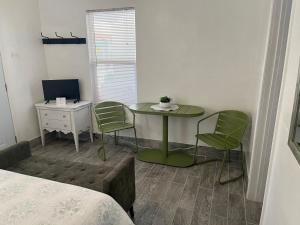 a room with a table and two chairs and a bed at Cozy Weekend Retreat! in Wofford Heights
