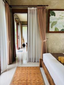 a bedroom with a bed and a large window at ELForest ex Karang Dukuh Villa, Ubud in Payangan +23 photos