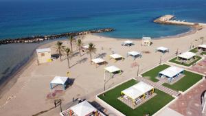 an aerial view of a beach with tents and the ocean at Breezot Yam in Nahariyya +22 photos