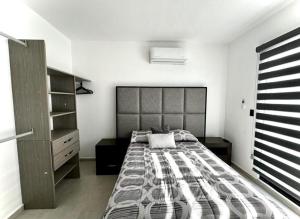 Ένα ή περισσότερα κρεβάτια σε δωμάτιο στο House in New Nayarit