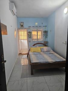 Ένα ή περισσότερα κρεβάτια σε δωμάτιο στο Residence MarinaY