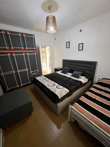 a bedroom with two beds in a room at La casita the Aye in Villa Carlos Paz
