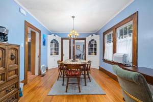 a dining room with a table and chairs at Historic 2 Bdr across from Lakeside Park in Fort Wayne